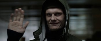 Movie still from “Department Q: The Keeper of Lost Causes” (2013), directed by Mikkel Nørgaard – A person wearing a hooded jacket; Close Up shot, Low angle