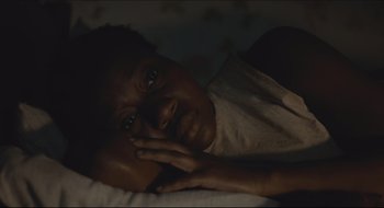 Movie still from “The Keeping Room” (2014), directed by Daniel Barber – A woman laying in bed with her head resting on a pillow; Close Up shot, High angle