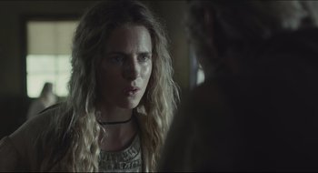 Movie still from “The Keeping Room” (2014), directed by Daniel Barber – A woman with long blonde curly hair looking at a man; Close Up shot, Over the shoulder angle