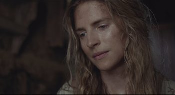 Movie still from “The Keeping Room” (2014), directed by Daniel Barber – A person with long blonde hair; Close Up shot, Low angle