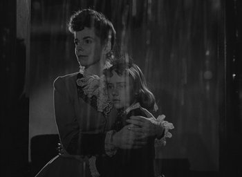 Movie still from “The Keys of the Kingdom” (1944), directed by John M. Stahl – A woman and a girl are standing next to each other; Medium shot, Low angle