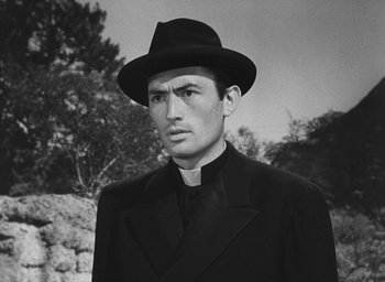 Movie still from “The Keys of the Kingdom” (1944), directed by John M. Stahl – A man wearing a priest's outfit and a hat; Close Up shot, Low angle