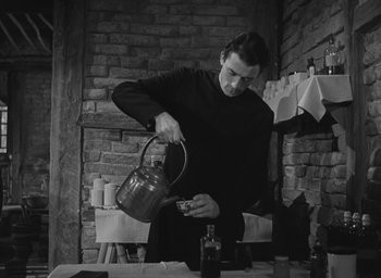 Movie still from “The Keys of the Kingdom” (1944), directed by John M. Stahl – A man pouring tea into a tea pot; Medium shot, Low angle