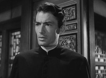 Movie still from “The Keys of the Kingdom” (1944), directed by John M. Stahl – A black and white photo of a man in a priest's outfit; Close Up shot, Low angle