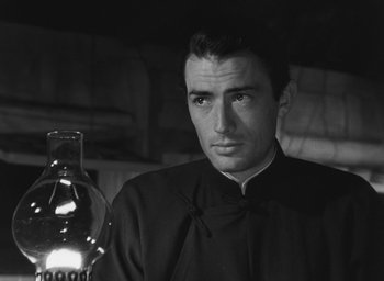 Movie still from “The Keys of the Kingdom” (1944), directed by John M. Stahl – Black and white photograph of a man in a priest's outfit; Close Up shot, Low angle