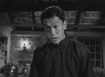 Movie still from “The Keys of the Kingdom” (1944), directed by John M. Stahl – A black and white photo of a man in a black shirt; Close Up shot, Low angle