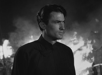 Movie still from “The Keys of the Kingdom” (1944), directed by John M. Stahl – Black and white photograph of a man in a black shirt; Close Up shot, Low angle