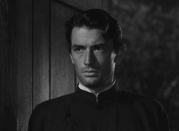 Movie still from “The Keys of the Kingdom” (1944), directed by John M. Stahl – Black and white photograph of a man in a priest's outfit; Close Up shot, Low angle