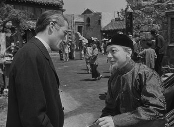 Movie still from “The Keys of the Kingdom” (1944), directed by John M. Stahl – A man and a woman talking to each other in an alley; Medium shot, Over the shoulder angle