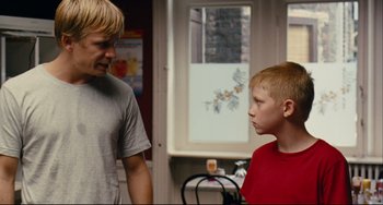 Movie still from “The Kid with a Bike” (2011), directed by Jean-Pierre Dardenne – A man and a boy talking to each other; Medium shot, Over the shoulder angle