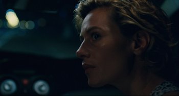 Movie still from “The Kid with a Bike” (2011), directed by Jean-Pierre Dardenne – A person's face in the dark; Close Up shot, Over the shoulder angle