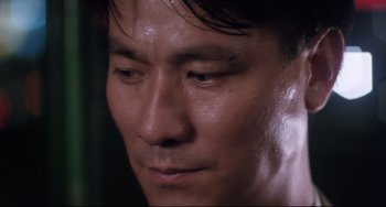 Movie still from “The Killer” (1989), directed by John Woo – A man's eyes and face; Close Up shot, Low angle