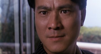 Movie still from “The Killer” (1989), directed by John Woo – A man's eyes and face; Close Up shot, Low angle