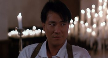 Movie still from “The Killer” (1989), directed by John Woo – A person wearing an apron; Close Up shot, Low angle