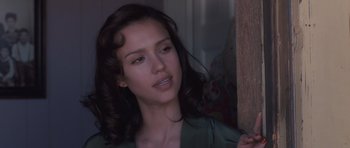 Movie still from “The Killer Inside Me” (2010), directed by Michael Winterbottom – A beautiful young woman with a long , brown hair; Close Up shot, Over the shoulder angle