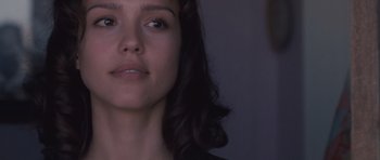 Movie still from “The Killer Inside Me” (2010), directed by Michael Winterbottom – A woman's face in the dark; Close Up shot, Over the shoulder angle