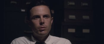 Movie still from “The Killer Inside Me” (2010), directed by Michael Winterbottom – A person wearing a shirt and tie; Close Up shot, Low angle