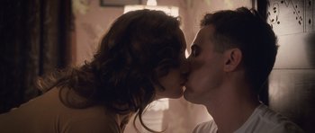 Movie still from “The Killer Inside Me” (2010), directed by Michael Winterbottom – A man and a woman kissing each other; Close Up shot, Low angle