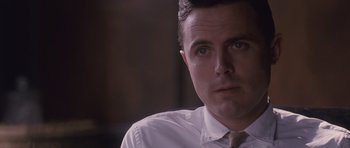 Movie still from “The Killer Inside Me” (2010), directed by Michael Winterbottom – A person wearing a shirt and a tie; Close Up shot, Over the shoulder angle