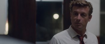 Movie still from “The Killer Inside Me” (2010), directed by Michael Winterbottom – A person wearing a white dress shirt; Close Up shot, Over the shoulder angle