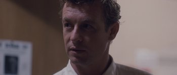 Movie still from “The Killer Inside Me” (2010), directed by Michael Winterbottom – A person wearing a white shirt; Close Up shot, Over the shoulder angle