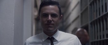 Movie still from “The Killer Inside Me” (2010), directed by Michael Winterbottom – A person wearing a shirt and tie; Close Up shot, Low angle