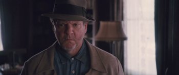 Movie still from “The Killer Inside Me” (2010), directed by Michael Winterbottom – An older man wearing a hat and a jacket; Close Up shot, Low angle