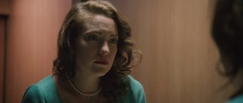 Movie still from “The Killer Inside Me” (2010), directed by Michael Winterbottom – A person wearing a necklace; Close Up shot, Over the shoulder angle