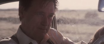 Movie still from “The Killer Inside Me” (2010), directed by Michael Winterbottom – A person sitting in a car; Close Up shot, Over the shoulder angle