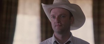 Movie still from “The Killer Inside Me” (2010), directed by Michael Winterbottom – A person wearing a cowboy hat; Close Up shot, Low angle