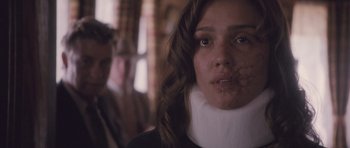 Movie still from “The Killer Inside Me” (2010), directed by Michael Winterbottom – A woman with a neck brace on her head; Close Up shot, Over the shoulder angle