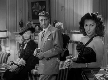 Movie still from “The Killers” (1946), directed by Robert Siodmak – A group of people standing next to each other holding wine glasses; Medium shot, Low angle