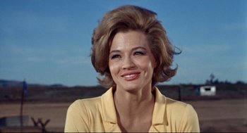 Movie still from “The Killers” (1964), directed by Don Siegel – A person wearing a yellow shirt; Close Up shot, Low angle