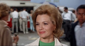 Movie still from “The Killers” (1964), directed by Don Siegel – A person wearing a green shirt; Close Up shot, Low angle