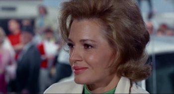 Movie still from “The Killers” (1964), directed by Don Siegel – A woman's face in a green shirt; Close Up shot, Over the shoulder angle