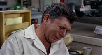 Movie still from “The Killers” (1964), directed by Don Siegel – An older man is crying in a white shirt; Close Up shot, High angle