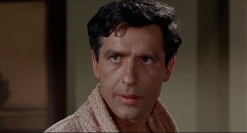 Movie still from “The Killers” (1964), directed by Don Siegel – A person wearing a robe; Close Up shot, High angle