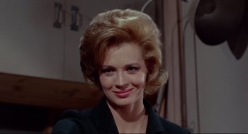 Movie still from “The Killers” (1964), directed by Don Siegel – A person wearing a suit; Close Up shot, Low angle