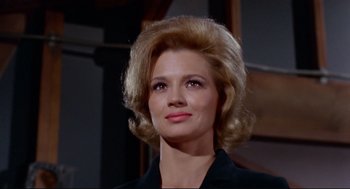 Movie still from “The Killers” (1964), directed by Don Siegel – A person wearing a suit and tie; Close Up shot, Low angle
