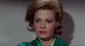 Movie still from “The Killers” (1964), directed by Don Siegel – A person wearing a green shirt; Close Up shot, High angle