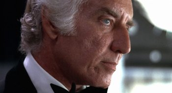 Movie still from “The Killing of a Chinese Bookie” (1976), directed by John Cassavetes – An older man wearing a tuxedo and a bow tie; Close Up shot, Low angle