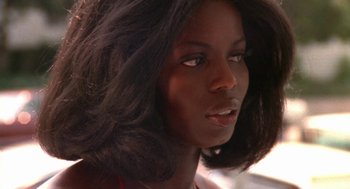 Movie still from “The Killing of a Chinese Bookie” (1976), directed by John Cassavetes – A woman's face with long black hair; Close Up shot, Low angle