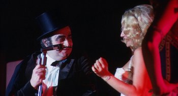 Movie still from “The Killing of a Chinese Bookie” (1976), directed by John Cassavetes – A man and a woman are talking to each other; Close Up shot, Over the shoulder angle