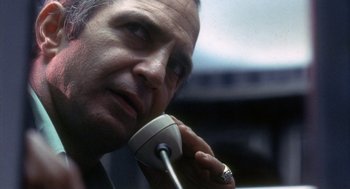 Movie still from “The Killing of a Chinese Bookie” (1976), directed by John Cassavetes – A person talking on a phone; Close Up shot, Low angle