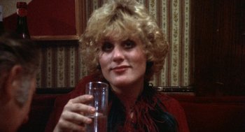 Movie still from “The Killing of a Chinese Bookie” (1976), directed by John Cassavetes – A woman holding a glass of wine in her hand; Close Up shot, Low angle