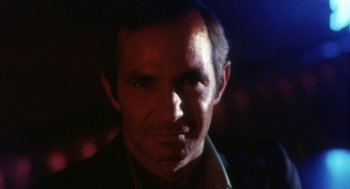 Movie still from “The Killing of a Chinese Bookie” (1976), directed by John Cassavetes – A person wearing a jacket; Close Up shot, Low angle