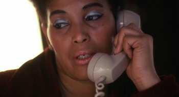 Movie still from “The Killing of a Chinese Bookie” (1976), directed by John Cassavetes – A person talking on a phone; Close Up shot, High angle
