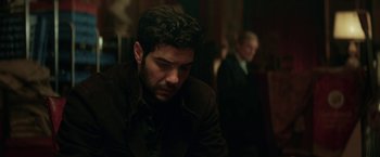 Movie still from “The Kindness of Strangers” (2019), directed by Lone Scherfig – A person sitting in front of another person; Close Up shot, Over the shoulder angle