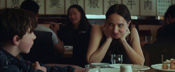 Movie still from “The Kindness of Strangers” (2019), directed by Lone Scherfig – A woman sitting at a table in front of another woman; Close Up shot, Over the shoulder angle