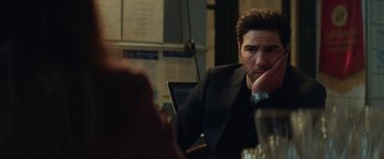 Movie still from “The Kindness of Strangers” (2019), directed by Lone Scherfig – A man sitting at a table in front of a laptop; Close Up shot, Over the shoulder angle